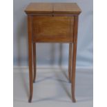 An Edwardian inlaid mahogany sewing table, on outswept legs, H.75 W.40 D.40cm