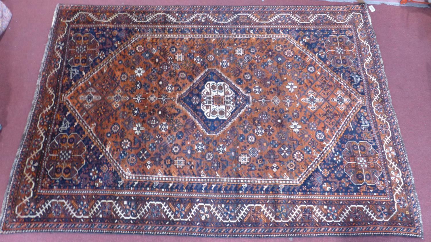 A South-West Persian Qashqai carpet, central diamond medallion with repeating petal and animal