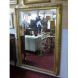 A late 19th century giltwood and gesso overmantle mirror with later plate, 169 x 120cm