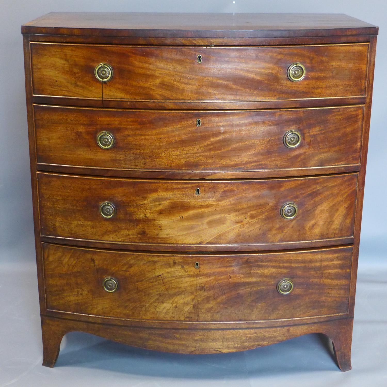 A George III mahogany bow fronted chest of 4 drawers, on splayed legs, H.107 W.98 D.56cm