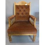 A late Victorian carved walnut framed armchair