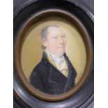 August Lutz, an oval portrait miniature of a gentleman in black coat with white waistcoat with