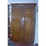 A Victorian mahogany wardrobe, the moulded cornice above two doors and two short over two long