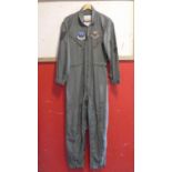 An American Ground Sergeant flight suit, with badges for United States Air Forces Central Command