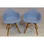 A pair of Eames style chairs