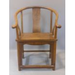 A 19th century Chinese hardwood horseshoe back armchair, probably Huanghuali wood, H.98 W.66 D.60cm