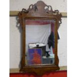 A Georgian walnut fretwork mirror, 75 x 44cm