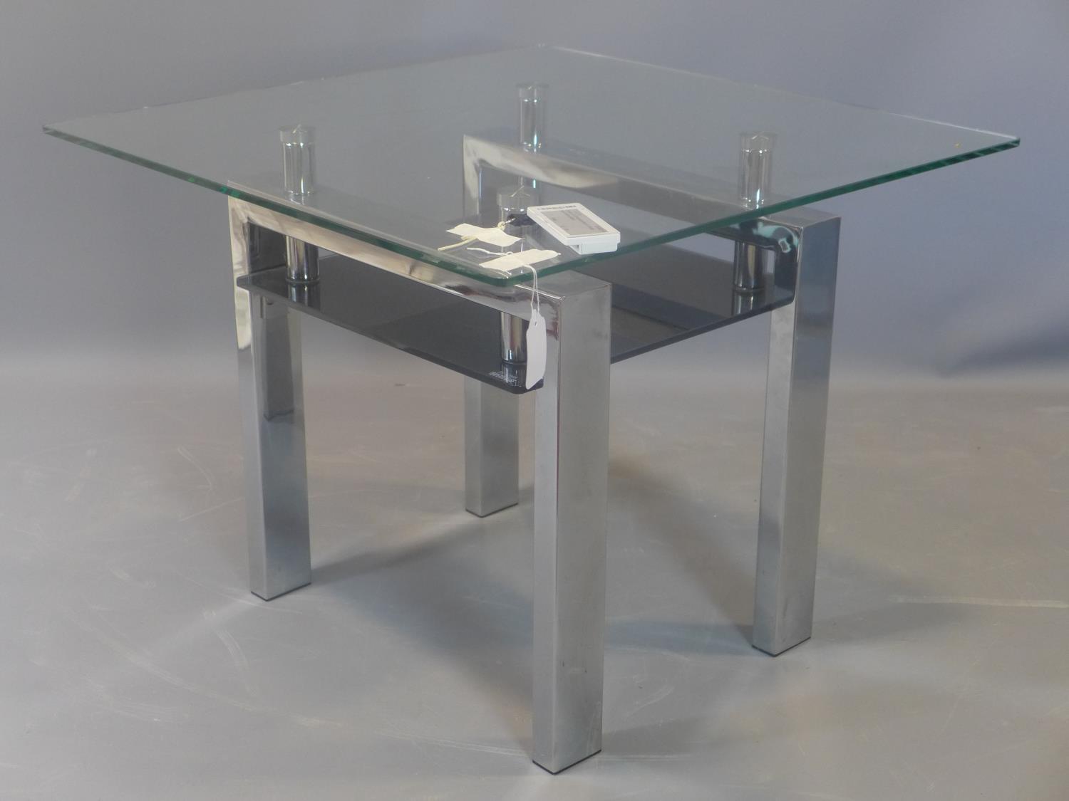 A contemporary chrome and glass side table, with black tempered glass undertier, H.50 W.65 D.65cm - Image 2 of 2