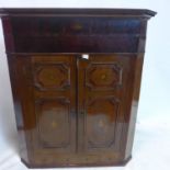 A Georgian oak and mahoagny corner cabinet, having 2 doors over 3 drawers with marquetry inlay, H.