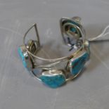 A Continental pierced silver bangle set with turquoise, marked 925