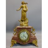 A late 19th century French variegated red marble and gilt metal mantle clock, drum movement (no