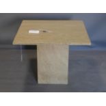 A square stone low table on pedestal base. H.50 W.60cm