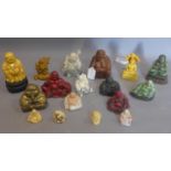 An extensive collection of moulded, carved wood and brass Buddha figures
