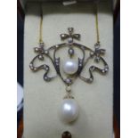 An Art Nouveau style necklace set with diamonds, seed pearls and cultured pearls, on a 9ct yellow