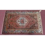 A north west Persian zanjar rug, the central diamond medallion with repeating petal motifs on