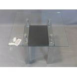 A contemporary chrome and glass side table, with black tempered glass undertier, H.50 W.65 D.65cm