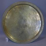 A mid to late 19th century finely chased Mamluk brass plate, with calligraphy, Diameter 65cm