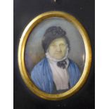 English school, c.1840, a painted oval miniature of an elderly lady wearing a black bonnet, black