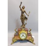 A 19th century Art Nouveau style mantle clock with spelter figural surmount. (damage to foot) H.56