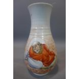 A Chinese vase decorated with Lohan to obverse and Chinese characters to reverse, H.23cm