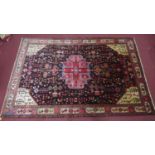 A north west Persian Nahawand carpet, the central pole medallion with repeating petal motifs on a