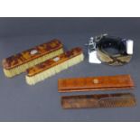 A cased Asprey tortoiseshell hair comb, with matching tortoiseshell and diamond set brushes, and a