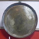 A mid to late 19th century finely chased Mamluk Persian brass plate, with calligraphy and
