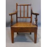 A Georgian oak childs elbow chair. H62cm