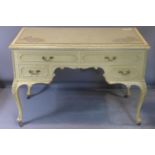 A cream painted French style writing desk fitted plate glass top. H.78 W.115 D.60cm