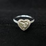 A platinum and diamond heart shaped ring, with round brilliant cut diamonds, 0.63cts total, colour