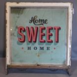 A wooden framed sign: Home Sweet Home. H.84 W.76cm