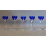 A set of 5 blue glasses signed by Moser. H.22cm