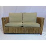 A rattan conservatory sofa with cushions, H.83 W.161 D.82cm