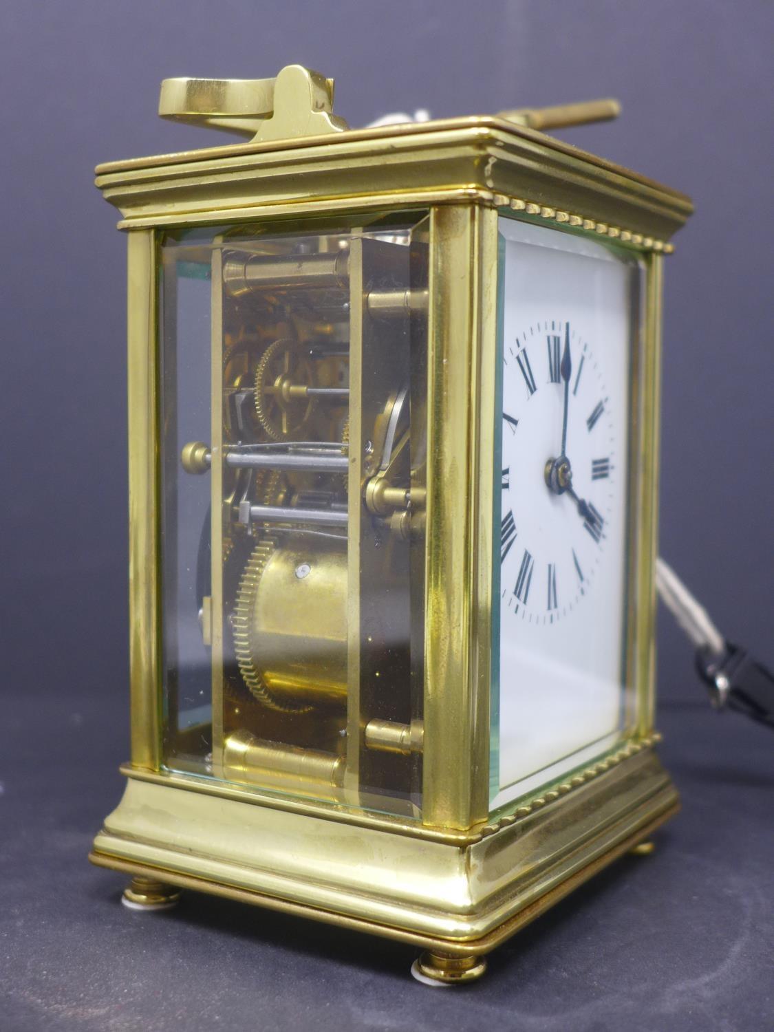 A 20th century French gilt brass carriage clock, the enamel dial with Roman numerals, having key, - Image 2 of 5