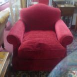 A Victorian style burgundy upholstered club armchair on mahogany turned supports H.90 W.90 D.96cm