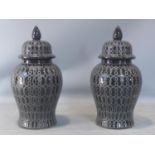 A pair of contemporary Chinese temple jars and covers, H.50cm