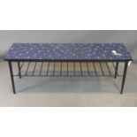 A laminate top two tier coffee table, with rack undertier, on tapered legs, H.41 W.117 D.38cm