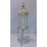 A contemporary gilt storm lantern, raised on a stand with scrolling feet, H.109cm