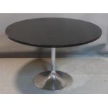 A Swedish Johanson Design Tulip dining table, with black circular top raised on chrome support and