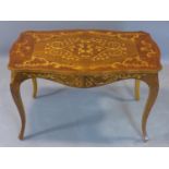 An Italian inlaid walnut table, with floral marquetry inlay to top, raised on cabriole legs, H.49