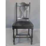 An Art Nouveau ebonised oak chair