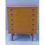 A mid 20th century teak chest of five drawers, raised on tapered legs, H.93 W.75 D.39cm