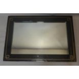 A black framed Art Deco style rectangular wall mirror, 101 x 70cm