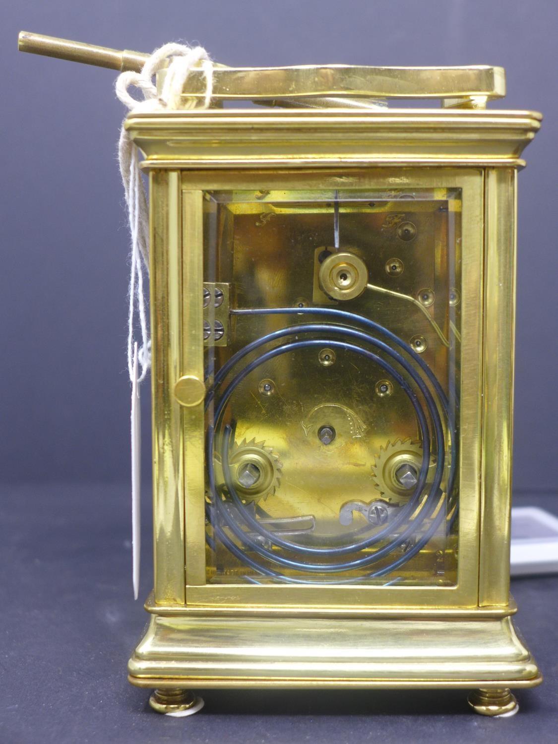 A 20th century French gilt brass carriage clock, the enamel dial with Roman numerals, having key, - Image 3 of 5