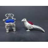 Two sterling silver pin cushions in the form of a miniature chair, 3.8 x 2.2cm, and a pheasant