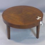 A circular oak side table, with quarter veneered top, having two brush slides, on square tapered