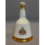 A Wade commemorative porcelain decanter from Bell's Scotch Whisky for the marriage of Prince