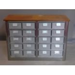 An Industrial style mahogany and metal chest of 20 drawers, H.70 W.100 D.40cm