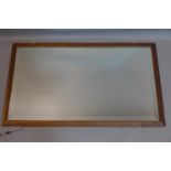 An oak framed mirror, with bevelled plate, 98 x 57cm