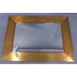 A contemporary copper clad mirror, with rectangular bevelled plate, 121 x 91cm